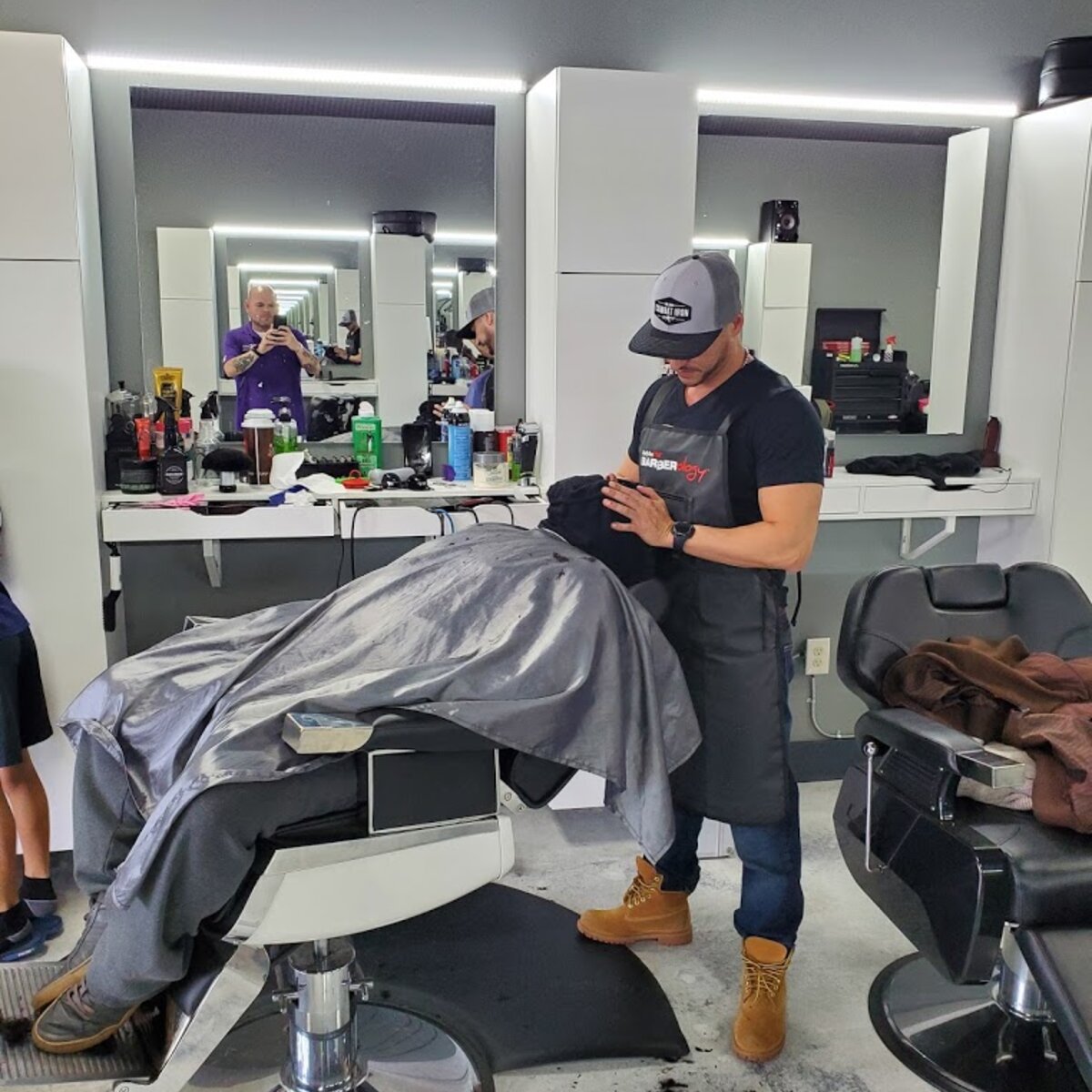 Barber at work at Creations by G Barbershop