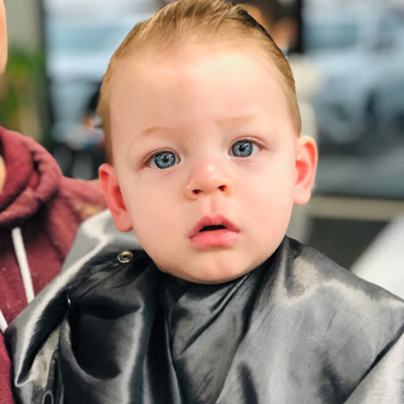 Baby's first haircut at the shop