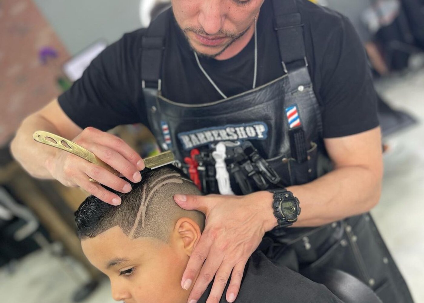 Barber giving a lineup inside Creations by G Barbershop in Dacula, Georgia
